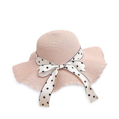 Women's woven straw hat with bow tie and wide brim