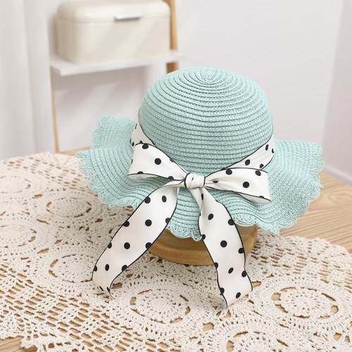 Women's woven straw hat with bow tie and wide brim
