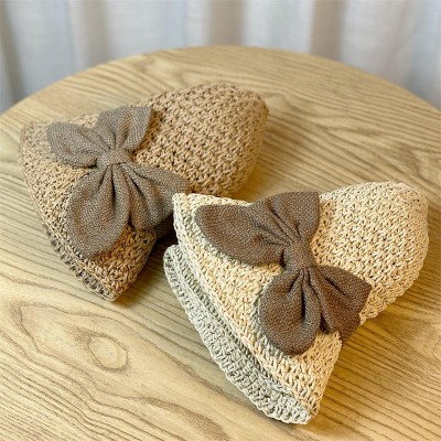 Women's woven straw hat with bow decoration