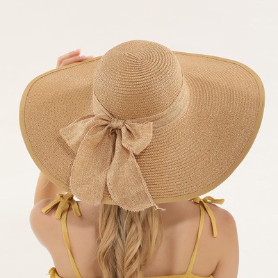 Women's woven straw hat with wide brim and bow