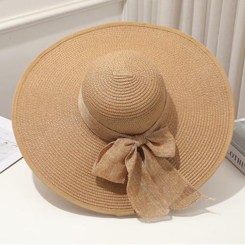 Women's woven straw hat with wide brim and bow
