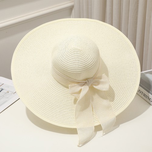 Women's woven straw hat with wide brim and bow