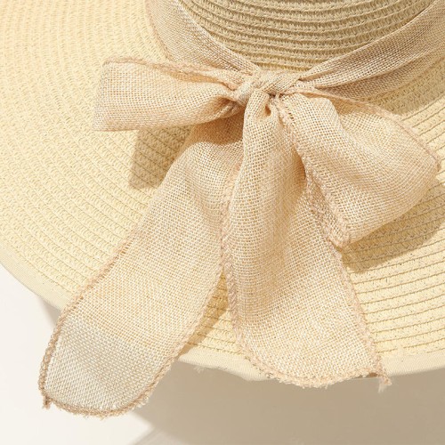 Women's woven straw hat with wide brim and bow